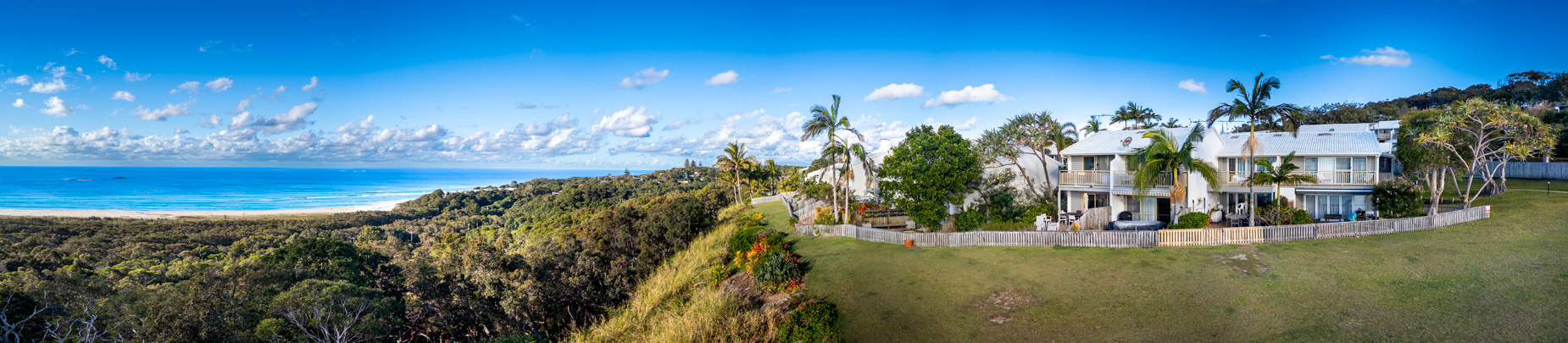 The open grassed headland reserve beside Pandanus Palms Resort, looking out over the sea