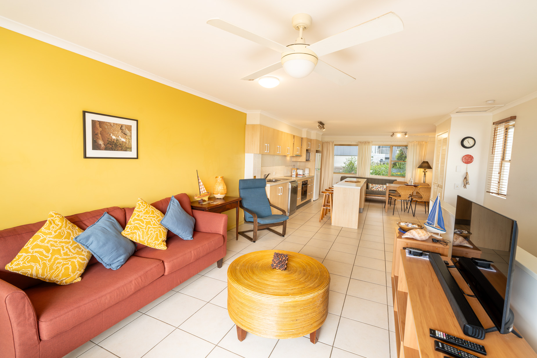 Open plan living room and kitchen inside a Standard Ocean villa at Pandanus Palms Resort
