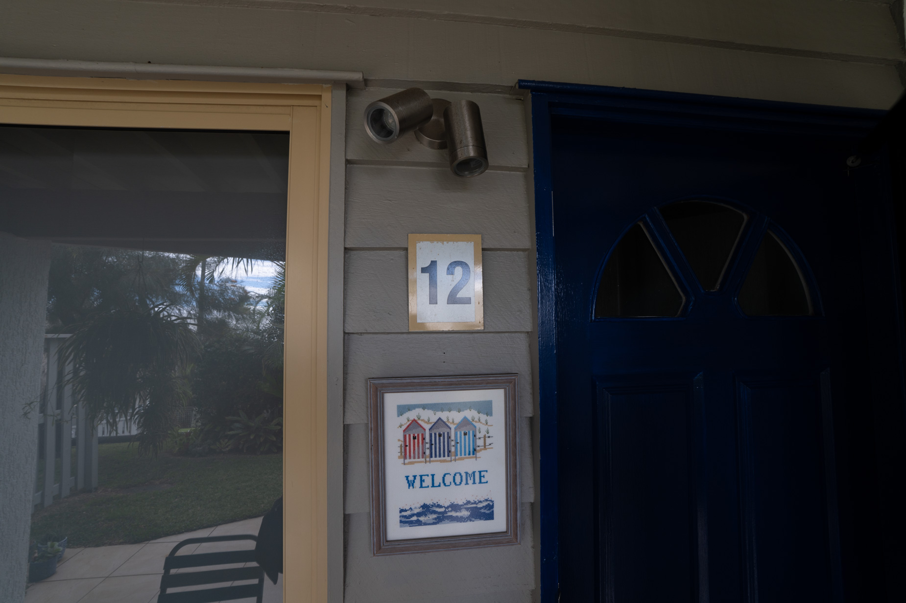 The front entrance of a Deluxe Ocean villa at Pandanus Palms Resort