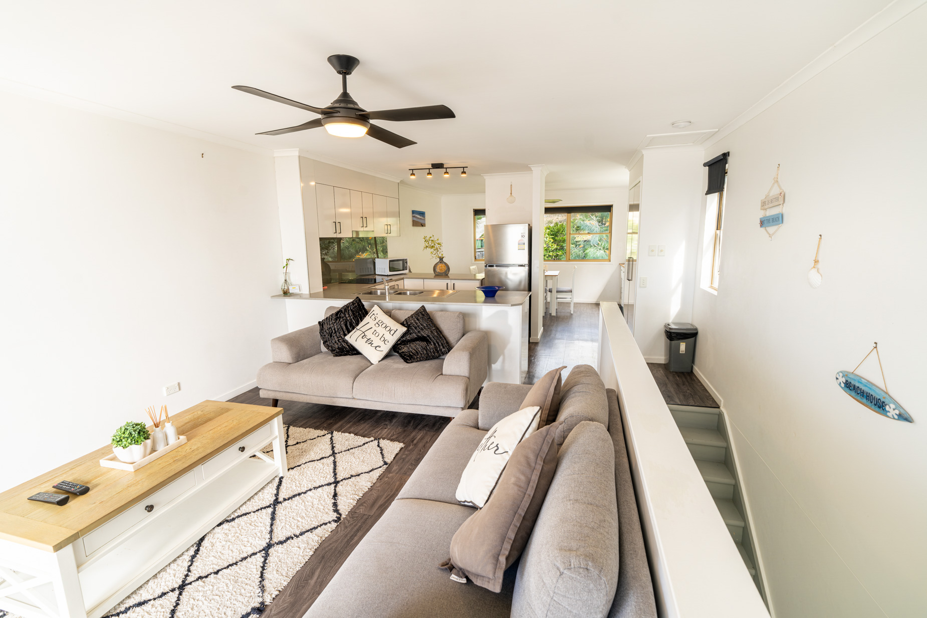 Open plan living room and kitchen inside a Standard Ocean villa at Pandanus Palms Resort
