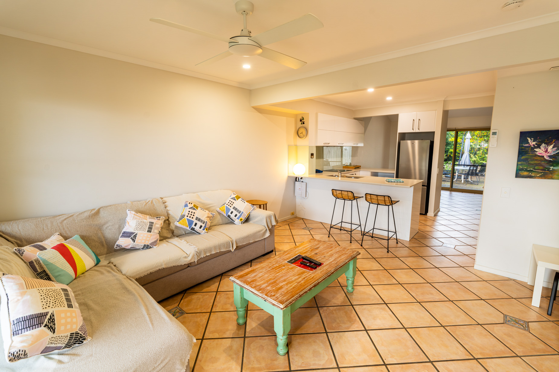 Open plan living room and kitchen inside a Standard Ocean villa at Pandanus Palms Resort