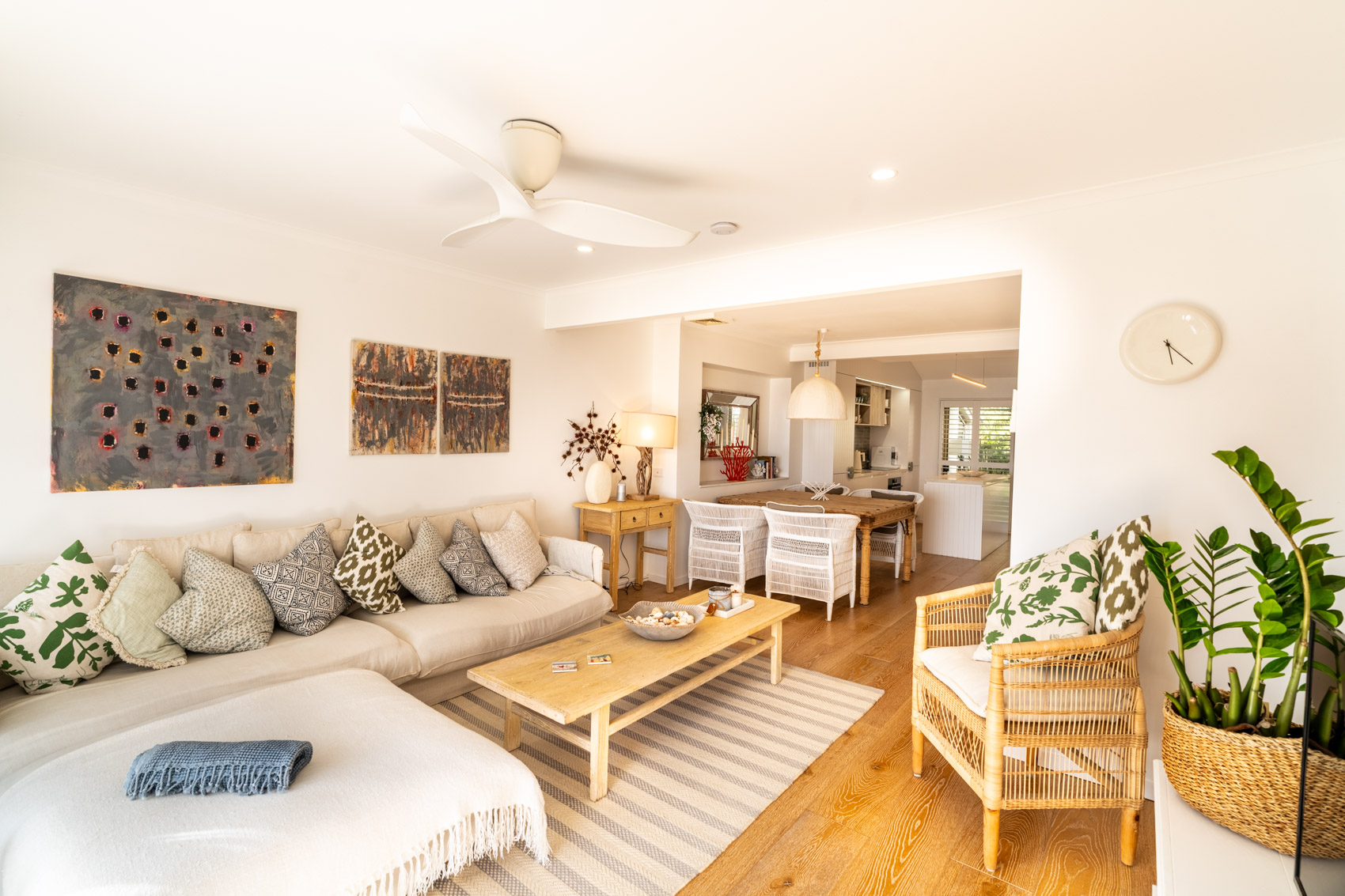 Open plan living room and kitchen inside a Prestige Headland Ocean villa at Pandanus Palms Resort