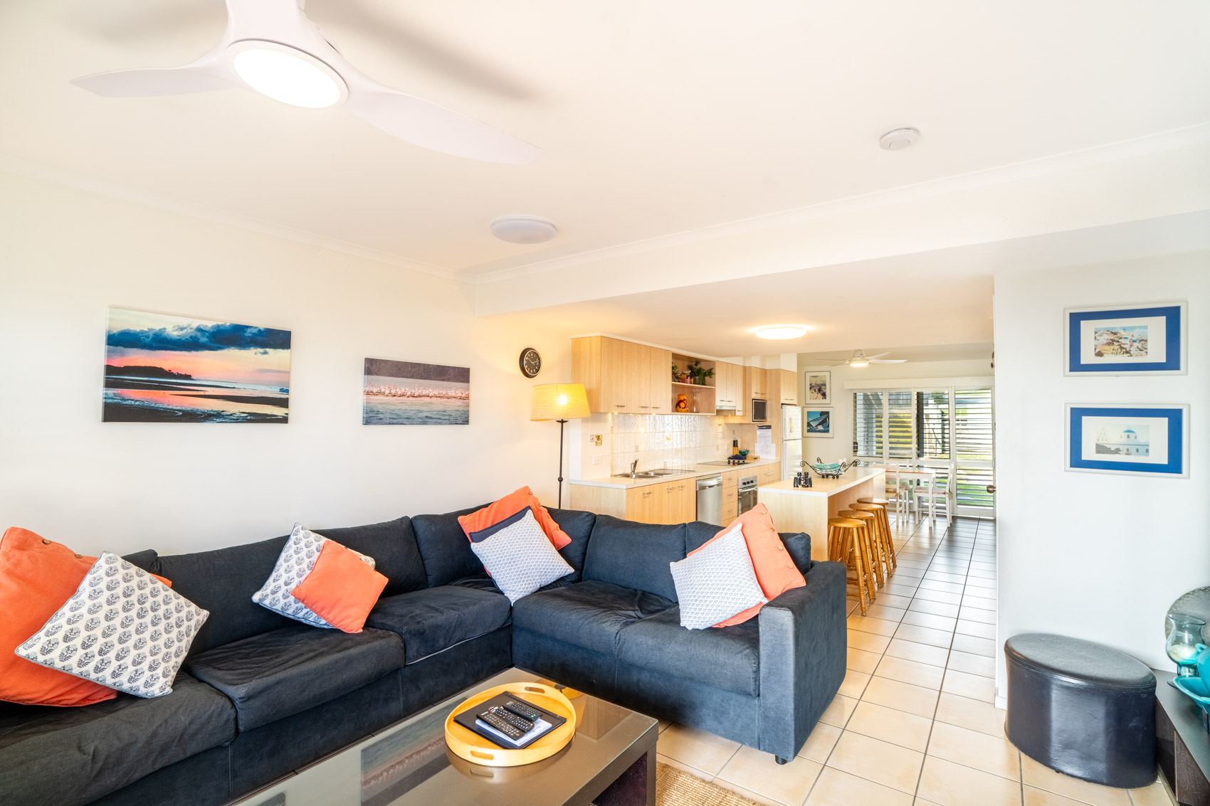 Open plan living room and kitchen inside a Premium Headland Ocean villa at Pandanus Palms Resort