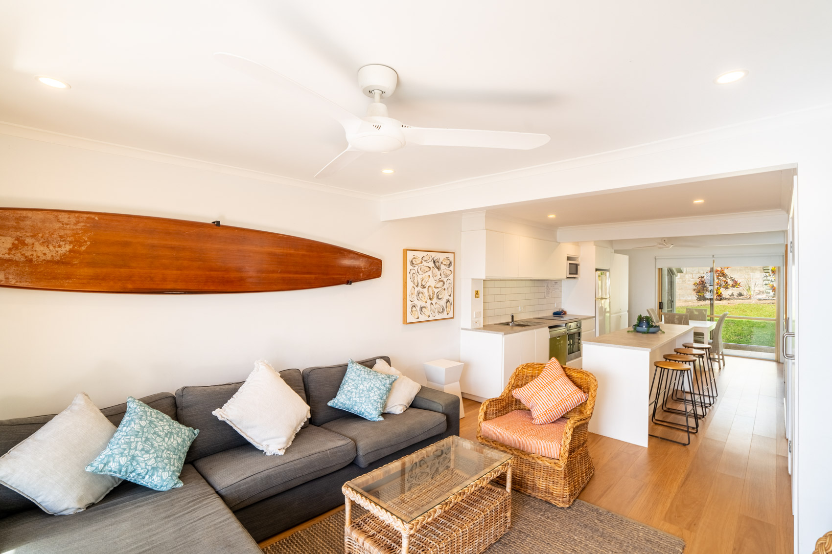 Open plan living room and kitchen inside a Premium Headland Ocean villa at Pandanus Palms Resort