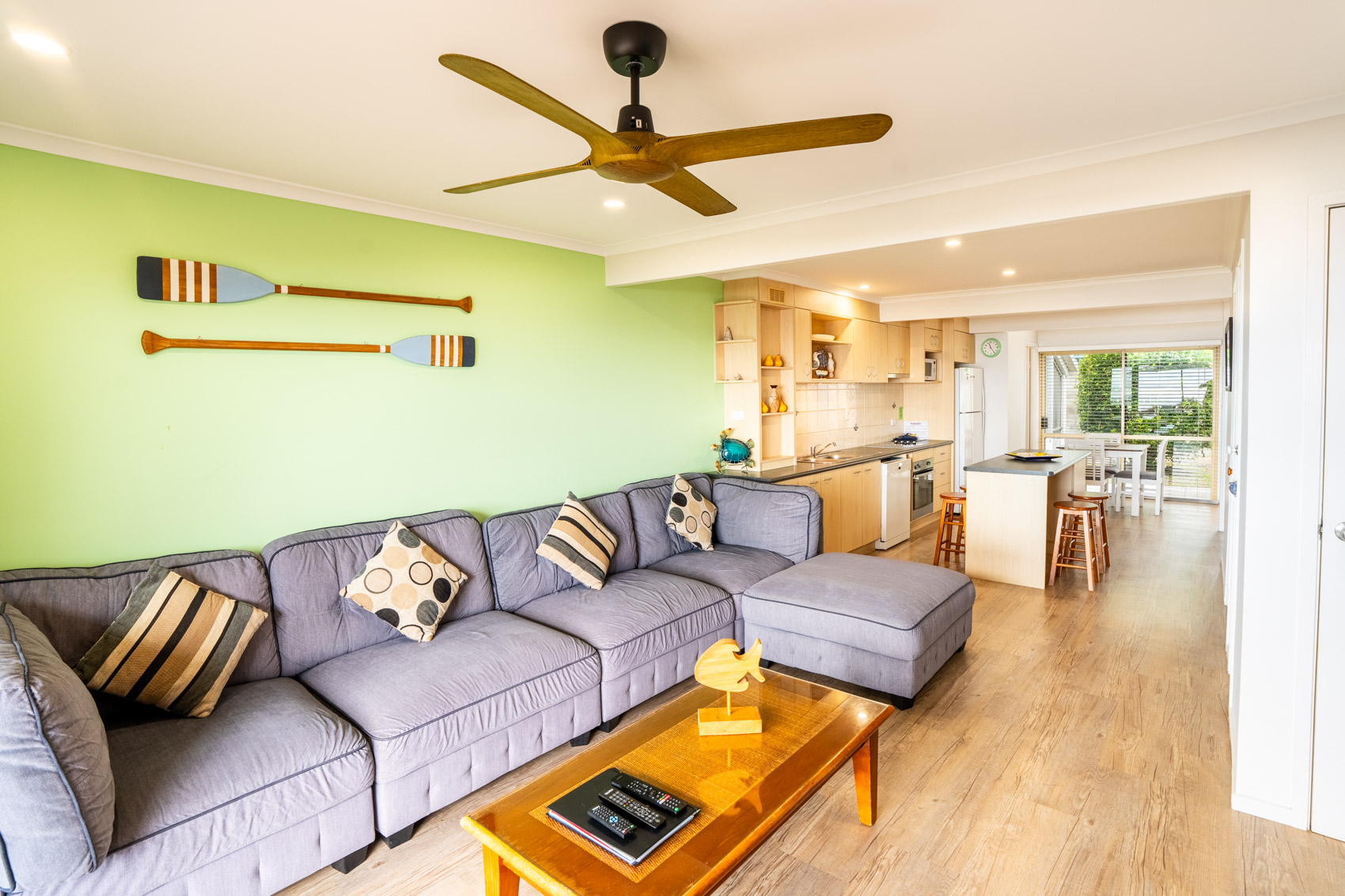 Open plan living room and kitchen inside a Premium Headland Ocean villa at Pandanus Palms Resort