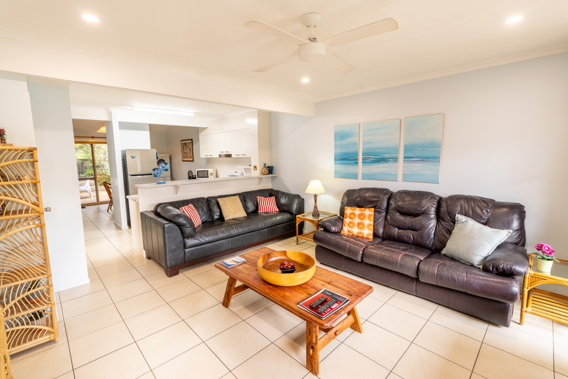 Open plan living room and kitchen inside a Standard Ocean villa at Pandanus Palms Resort