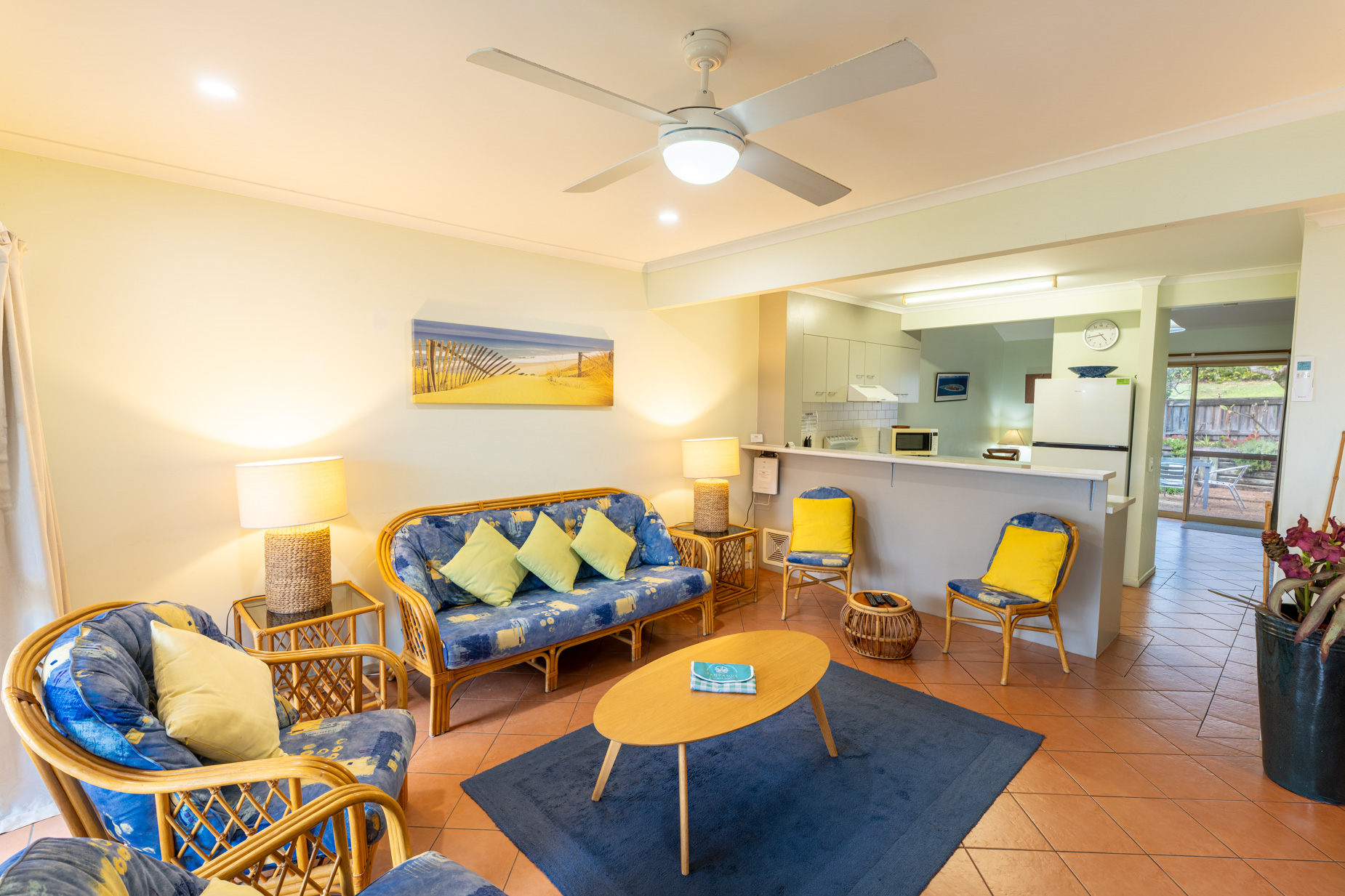 Open plan living room and kitchen inside a Standard Ocean villa at Pandanus Palms Resort