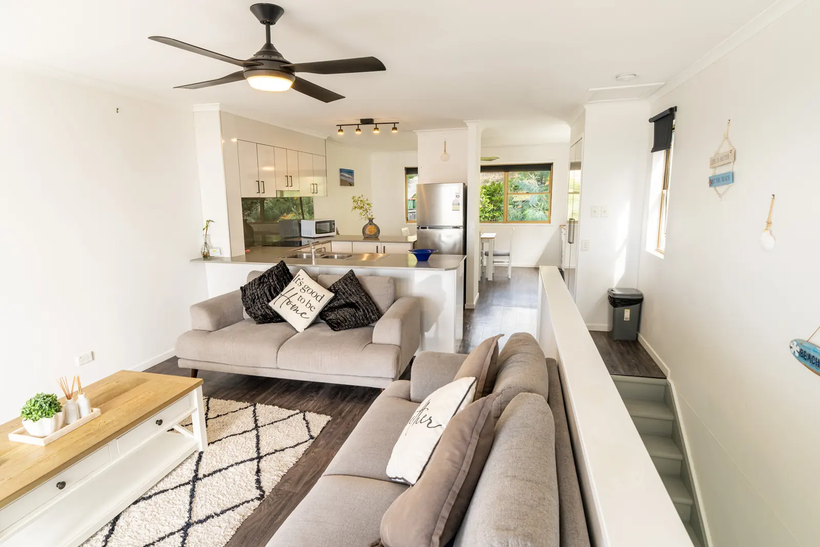 Open plan living room and kitchen inside a Standard Ocean villa at Pandanus Palms Resort