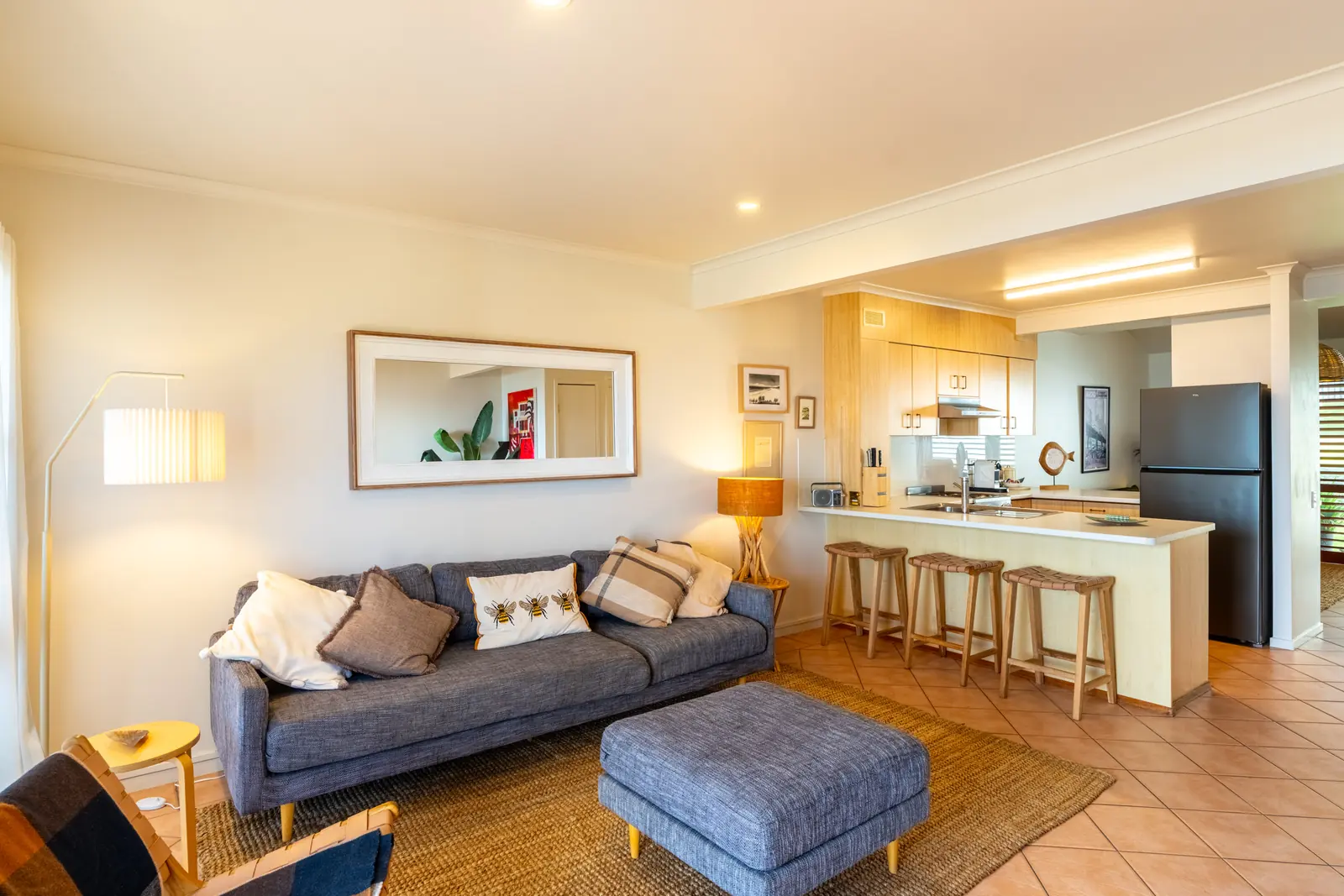 Open plan living room and kitchen inside a Prestige Headland Ocean villa at Pandanus Palms Resort