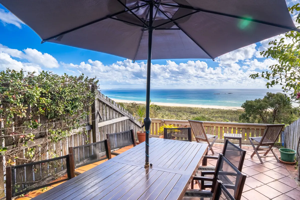The deck of a Premium Headland Ocean villa looking over the dune to the ocean