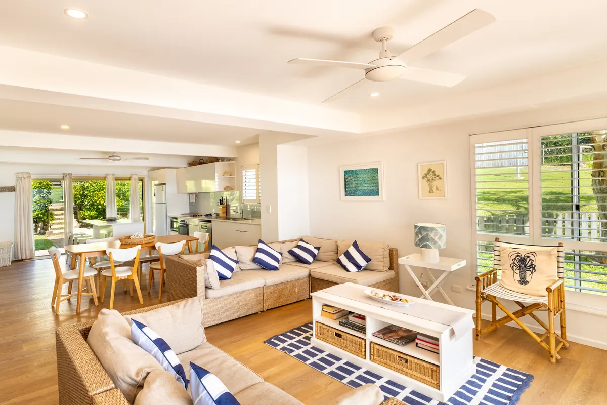 The living room of the three bedroom Prestige Headland Ocean villa
