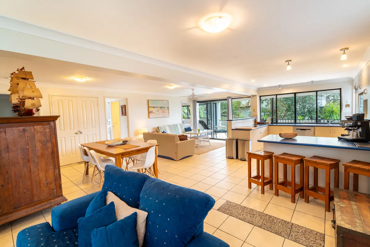 The open plan living, dining and kitchen area of the three bedroom house at 8th on Roseby
