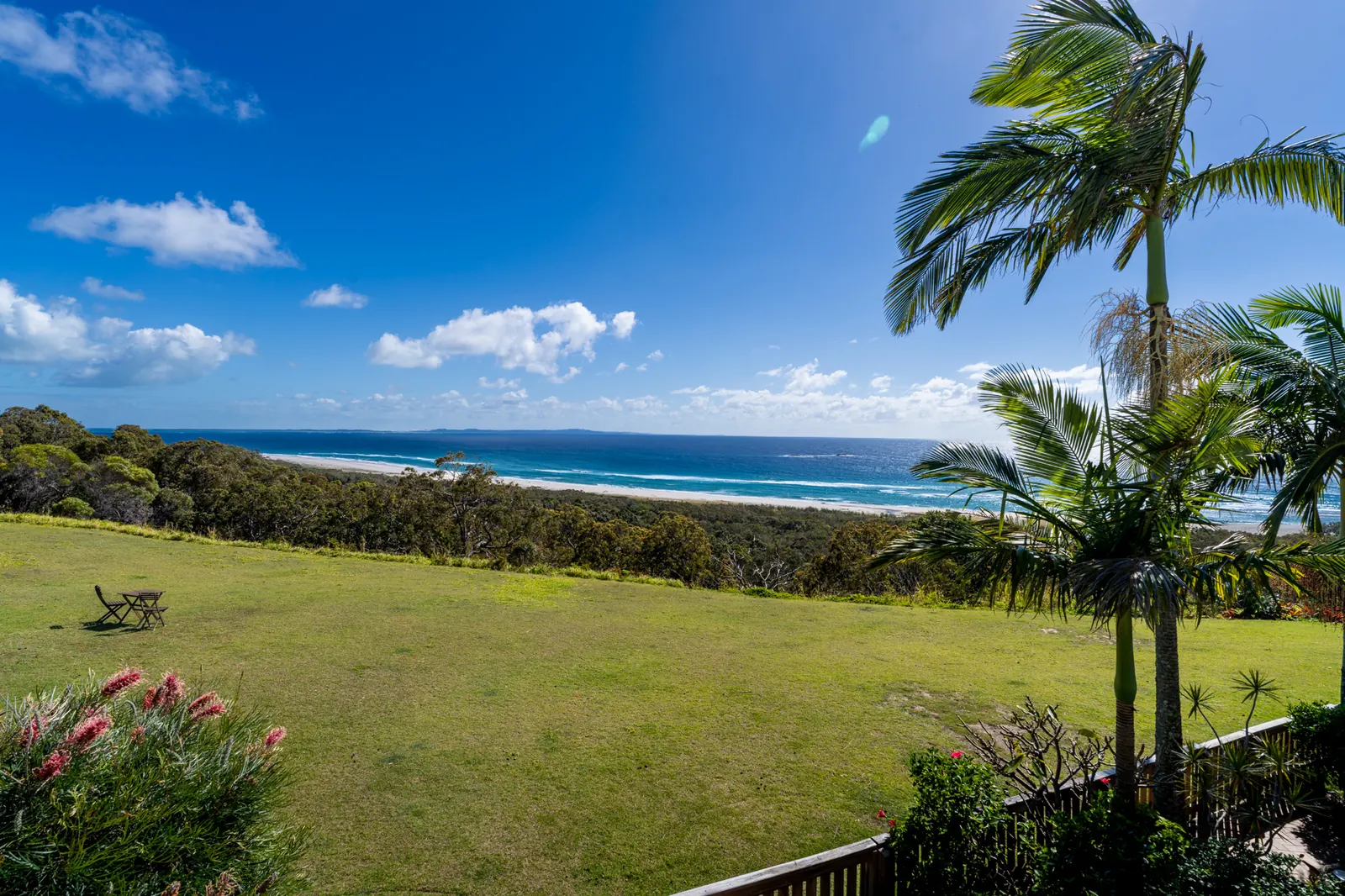 Ocean views across the headland lawn from a Prestige Headland Ocean 3 Bedroom villa